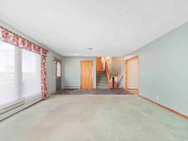 2801 W 700 S, Claypool, IN 46510 - unfurnished living room with baseboards, carpet, stairs, and a baseboard radiator