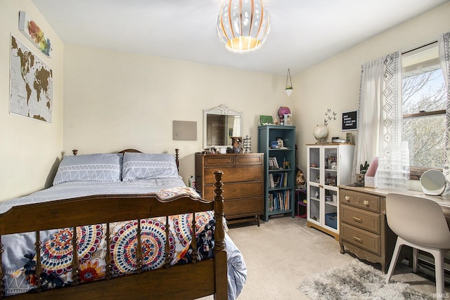 bedroom with light colored carpet