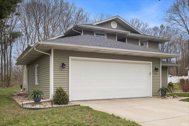 view of property exterior with driveway and a shingled roof