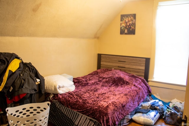 bedroom with vaulted ceiling