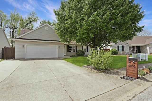 view of front of property with a garage, a front lawn, fence, and concrete driveway