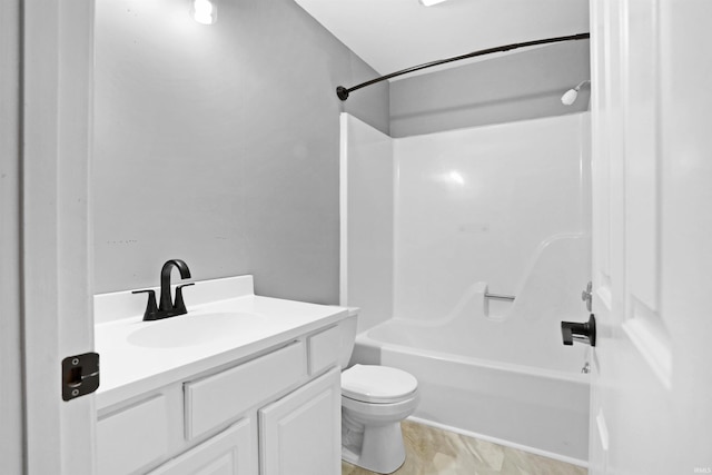 full bath featuring bathing tub / shower combination, vanity, and toilet