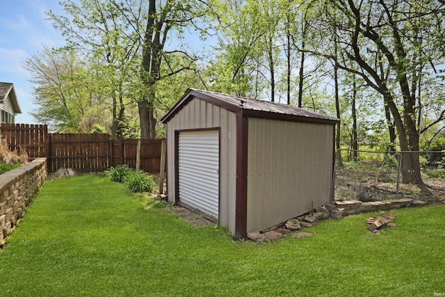 view of shed with a fenced backyard