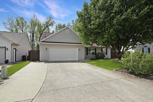 single story home featuring a garage, driveway, a front lawn, and fence