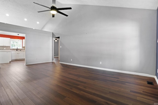 unfurnished living room with a ceiling fan, baseboards, recessed lighting, and dark wood-style flooring