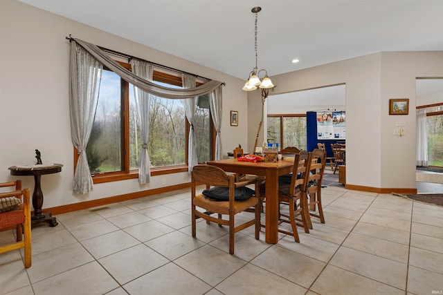 dining space with baseboards, light tile patterned flooring, and plenty of natural light