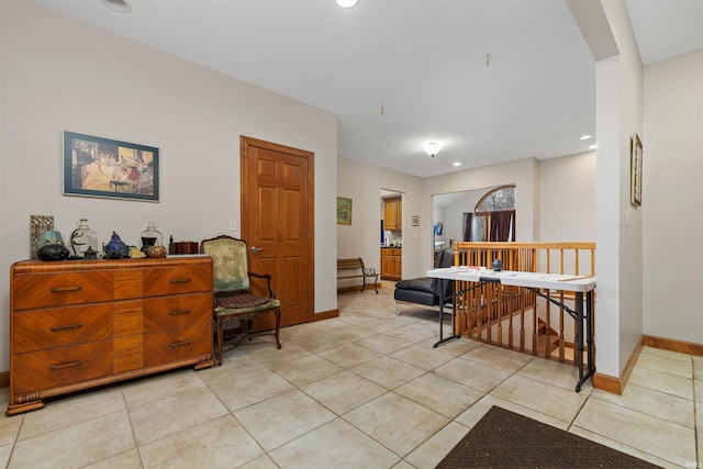 interior space featuring baseboards, recessed lighting, an upstairs landing, and light tile patterned floors