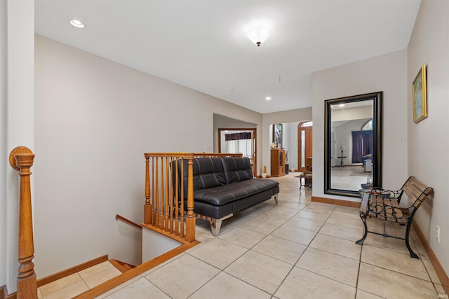 living room with recessed lighting, baseboards, and light tile patterned floors