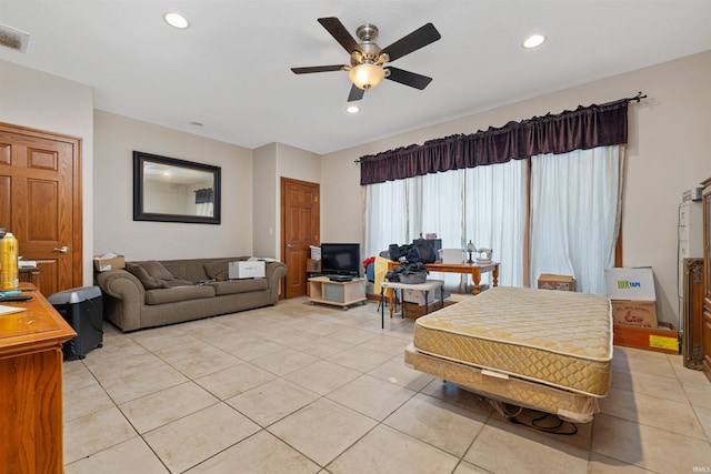 living area with a ceiling fan, recessed lighting, and light tile patterned floors