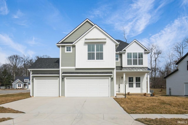 12793 Brick Rd Lot 4, Granger, IN 46530 - view of front of home with board and batten siding, an attached garage, covered porch, and concrete driveway