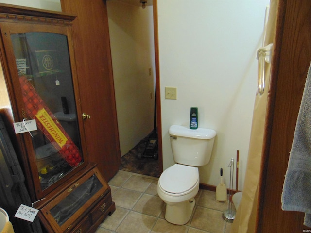 bathroom featuring tile patterned flooring and toilet
