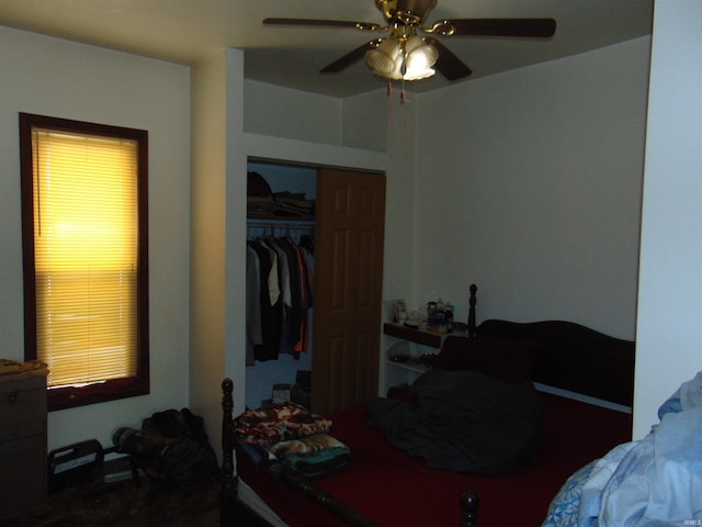 bedroom with a ceiling fan and a closet
