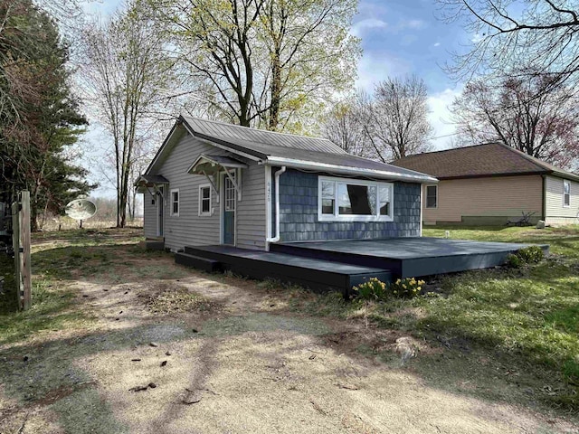 exterior space featuring metal roof