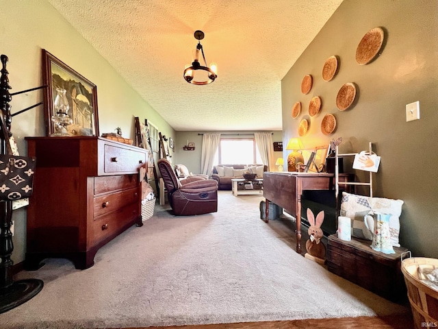 carpeted bedroom featuring a textured ceiling