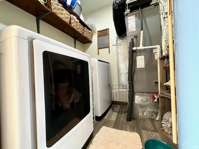laundry room featuring wood finished floors, washer / clothes dryer, and laundry area