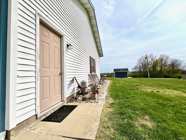 doorway to property with a lawn