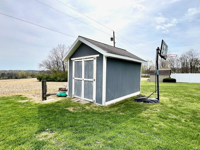 view of shed with fence