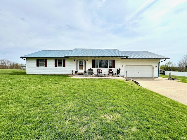 ranch-style house with a garage, driveway, a front lawn, and metal roof