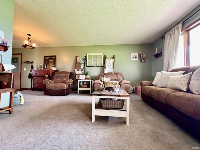 carpeted living area with a textured ceiling