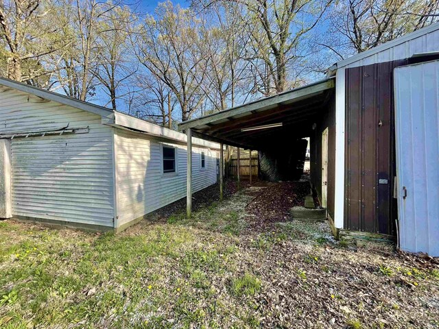 view of side of home with an outbuilding