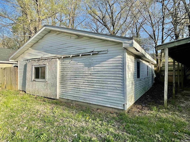 view of outbuilding with fence