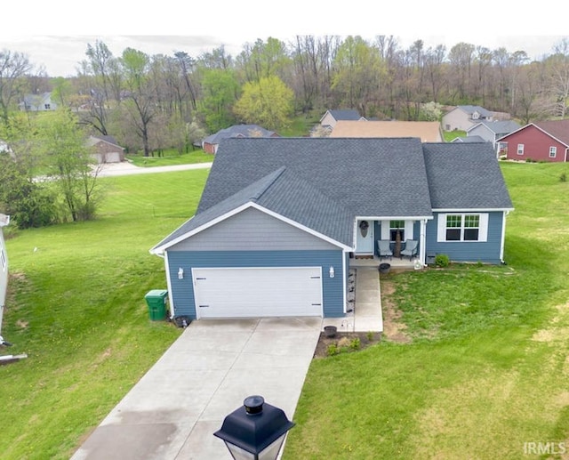 610 W Ryans Run, Spencer, IN 47460 - view of front facade featuring a garage, driveway, a front yard, and a shingled roof