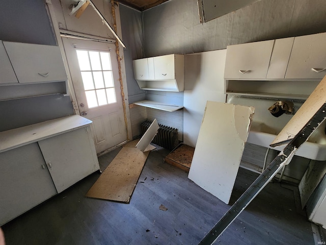 kitchen with white cabinetry and wood finished floors