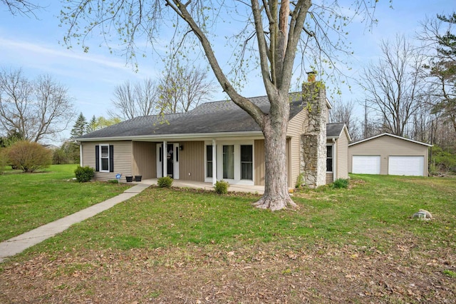 single story home featuring a detached garage, a chimney, a front lawn, a shingled roof, and an outbuilding