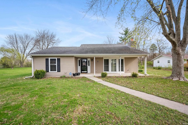 view of front of property with a chimney, a front lawn, and a porch