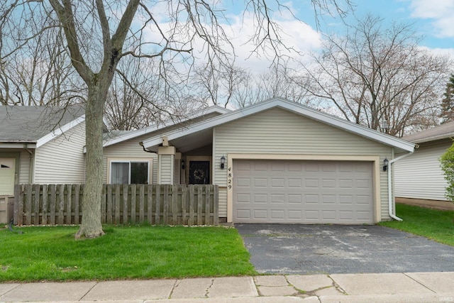4829 Kintyre Dr, South Bend, IN 46614 - single story home with an attached garage, a front yard, aphalt driveway, and fence