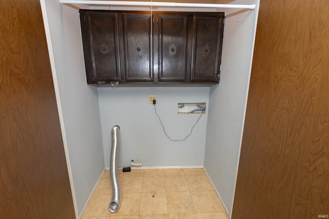 4829 Kintyre Dr, South Bend, IN 46614 - washroom with baseboards, cabinet space, light tile patterned flooring, and washer hookup