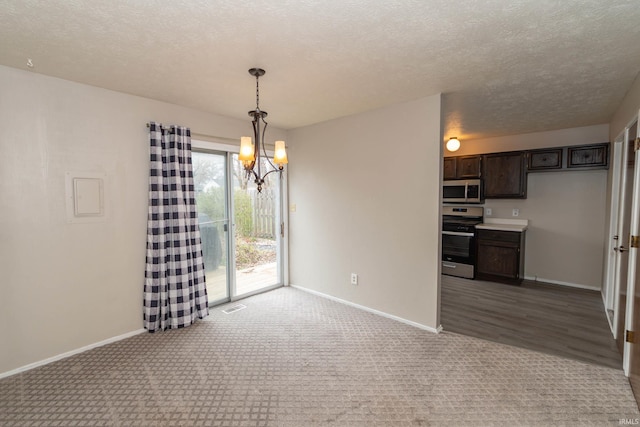 4829 Kintyre Dr, South Bend, IN 46614 - unfurnished dining area featuring baseboards, a chandelier, and a textured ceiling