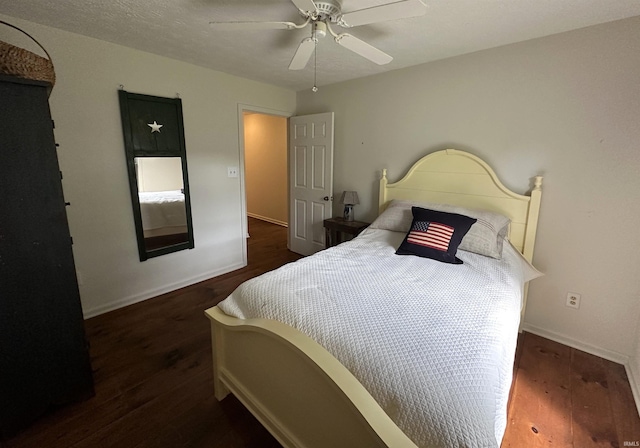 bedroom featuring baseboards, a ceiling fan, and wood finished floors