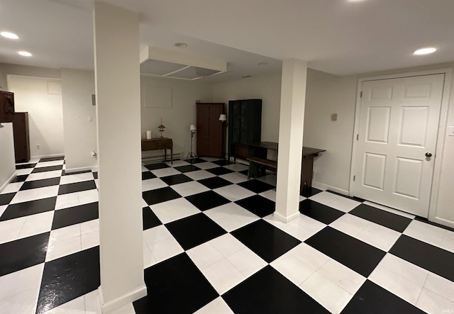 basement with baseboards and recessed lighting
