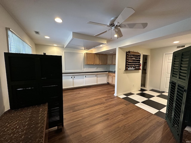 kitchen featuring ceiling fan, dark wood finished floors, baseboards, visible vents, and recessed lighting