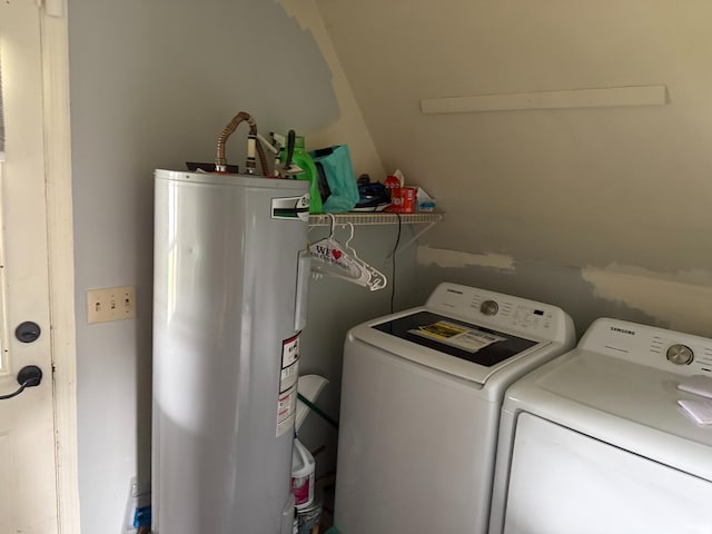 laundry room featuring washing machine and clothes dryer, laundry area, and electric water heater
