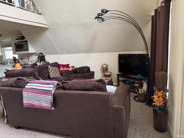 living room with vaulted ceiling and carpet floors