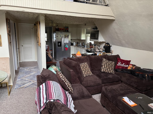living area featuring light colored carpet