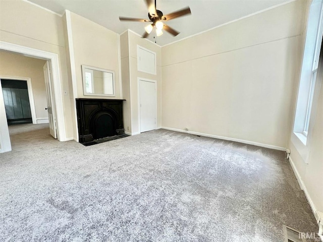 1926 W Indiana St, Evansville, IN 47712 - unfurnished living room featuring carpet flooring, baseboards, and a ceiling fan