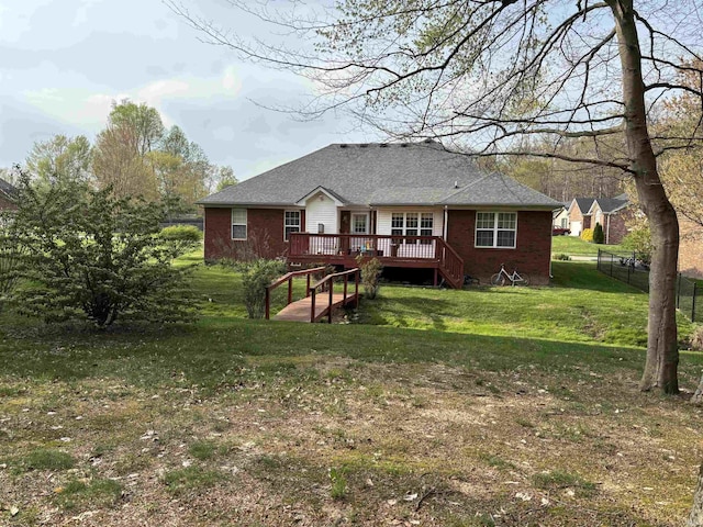 1807 Sterling Oaks Dr, Sellersburg, IN 47172 - rear view of house with fence, a lawn, brick siding, and a deck