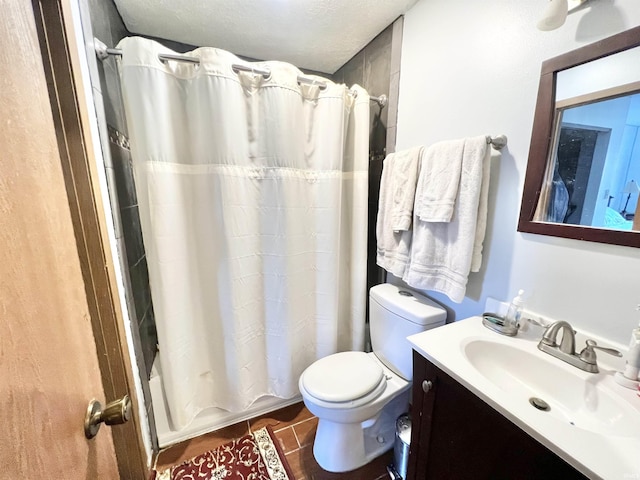 2421 S Brittany Ln, Bloomington, IN 47401 - full bathroom featuring a textured ceiling, toilet, shower / tub combo with curtain, tile patterned flooring, and vanity