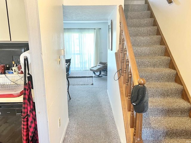 2421 S Brittany Ln, Bloomington, IN 47401 - staircase featuring carpet floors and baseboards
