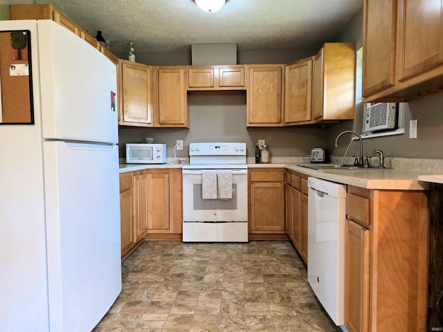 935 Fry Rd, Greenwood, IN 46142 - kitchen with white appliances, a sink, light countertops, stone finish floors, and a textured ceiling