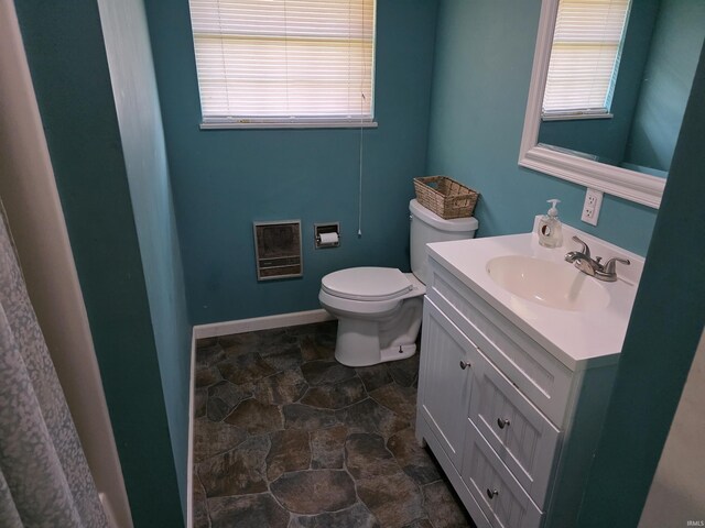 935 Fry Rd, Greenwood, IN 46142 - bathroom with vanity, toilet, healthy amount of natural light, and stone finish floors