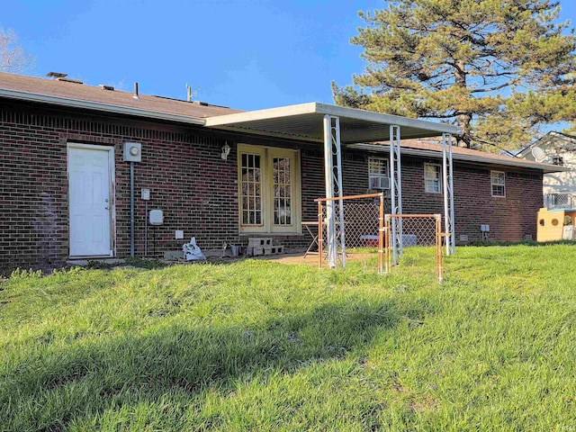 935 Fry Rd, Greenwood, IN 46142 - rear view of property featuring brick siding and a lawn