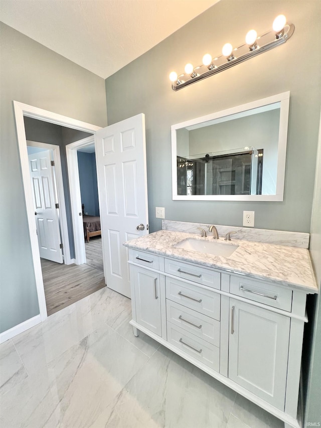 1505 High St, Logansport, IN 46947 - bathroom with baseboards, marble finish floor, and vanity