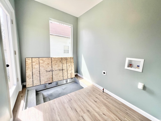 1505 High St, Logansport, IN 46947 - clothes washing area featuring laundry area, wood finished floors, hookup for an electric dryer, baseboards, and washer hookup
