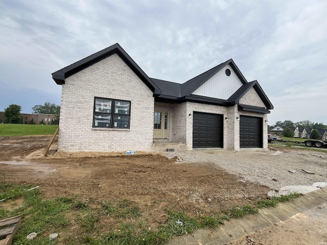 6021 Glencrest Ct, Newburgh, IN 47630 - view of front of property featuring brick siding, a garage, driveway, and board and batten siding