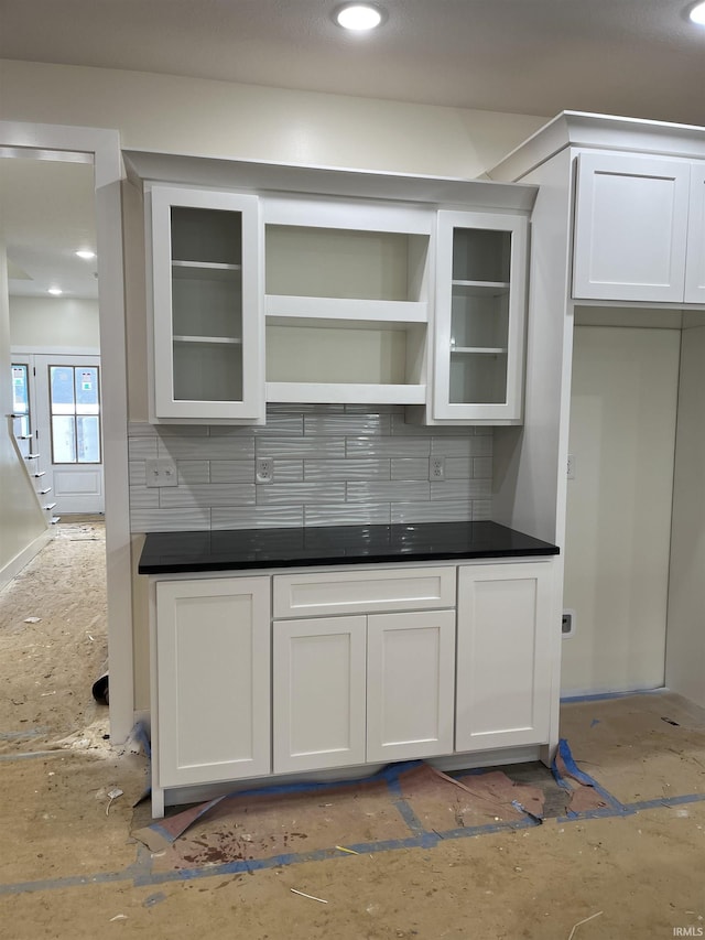 6021 Glencrest Ct, Newburgh, IN 47630 - kitchen featuring backsplash, white cabinets, glass insert cabinets, dark countertops, and recessed lighting