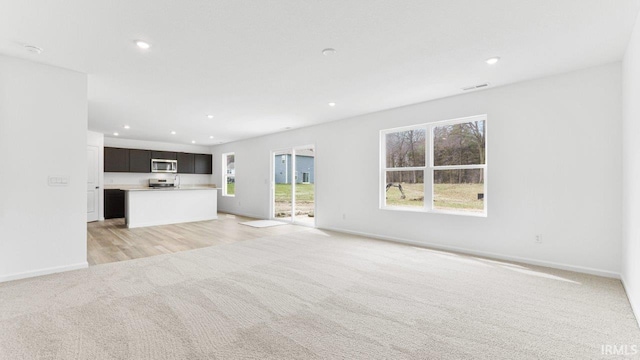 12826 Solo Ln, Fort Wayne, IN 46818 - unfurnished living room with light colored carpet and recessed lighting